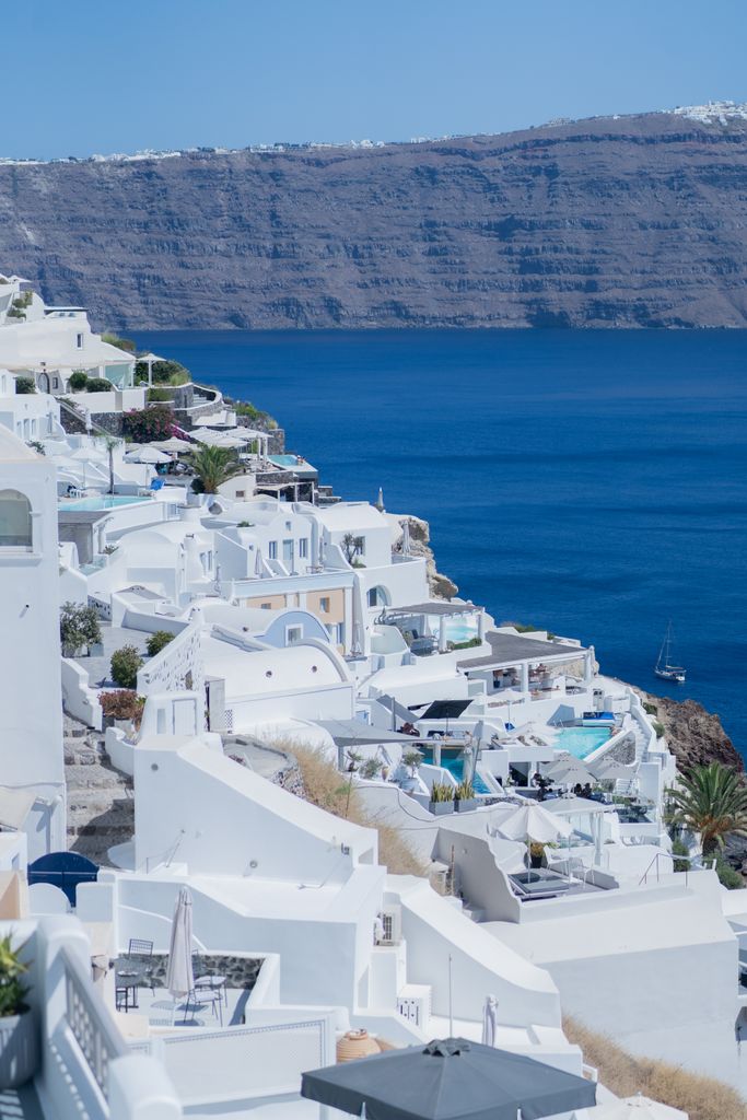 A stunning view of Santorini's iconic white architecture overlooking the deep blue Aegean Sea.