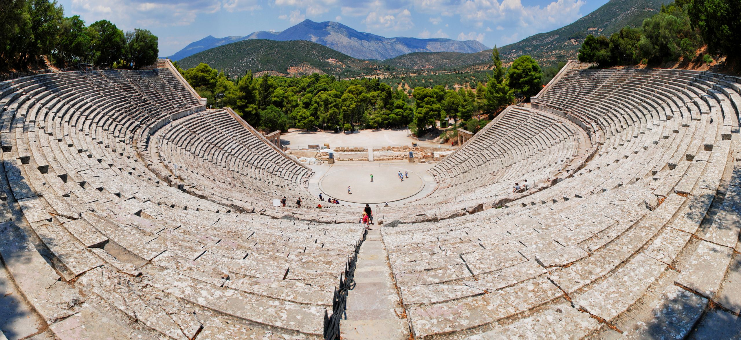 Stunning panoramic view of the ancient Epidaurus theater surrounded by lush greenery.